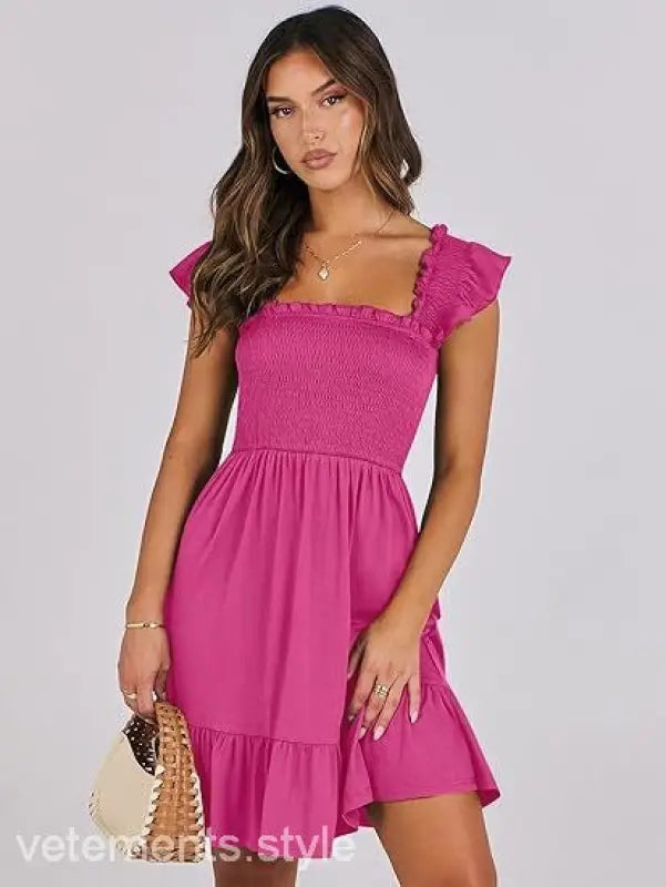 Pink smocked bodice dress featured in Elegant Backless Short Mini Dress with Ruffle Detail