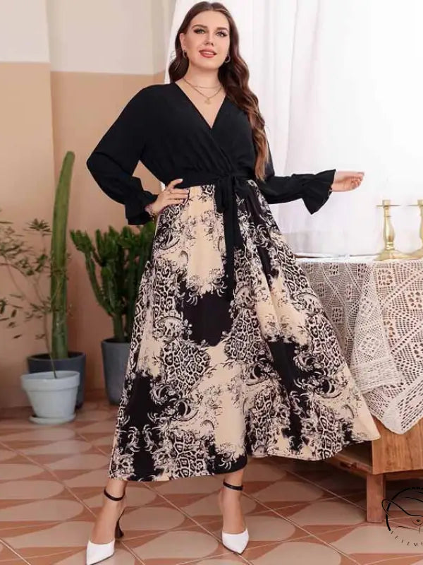 Elegant belted V-neck maxi dress with black top and patterned skirt