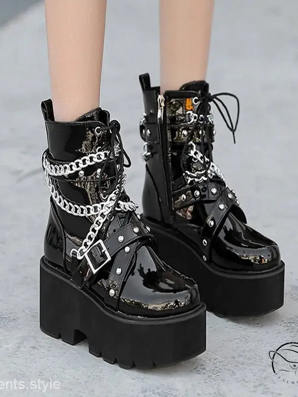 Chunky black high heel thigh high boots with chains and studs