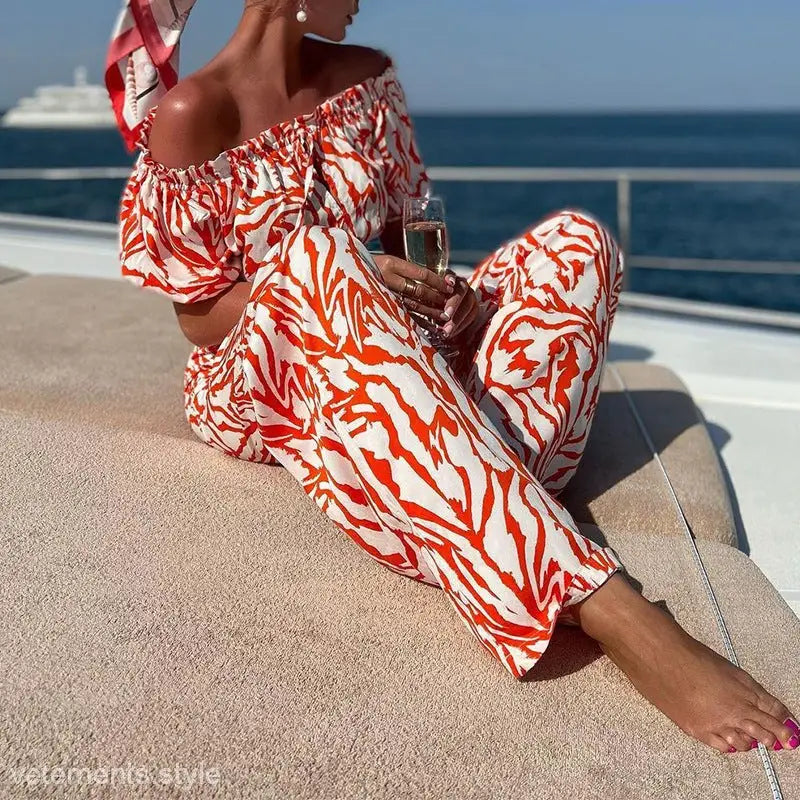 Off-the-shoulder jumpsuit in red and white abstract print, elegant black shoulder set with free shipping