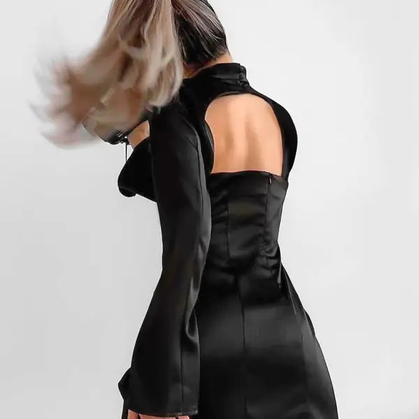 Elegant black short dress with long trumpet sleeves and open back for formal occasions