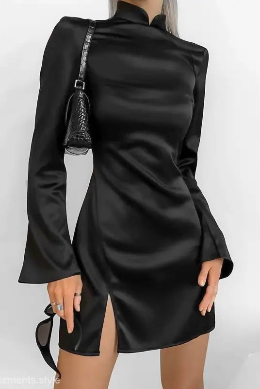 Elegant black short dress with backless design and trumpet sleeves displayed