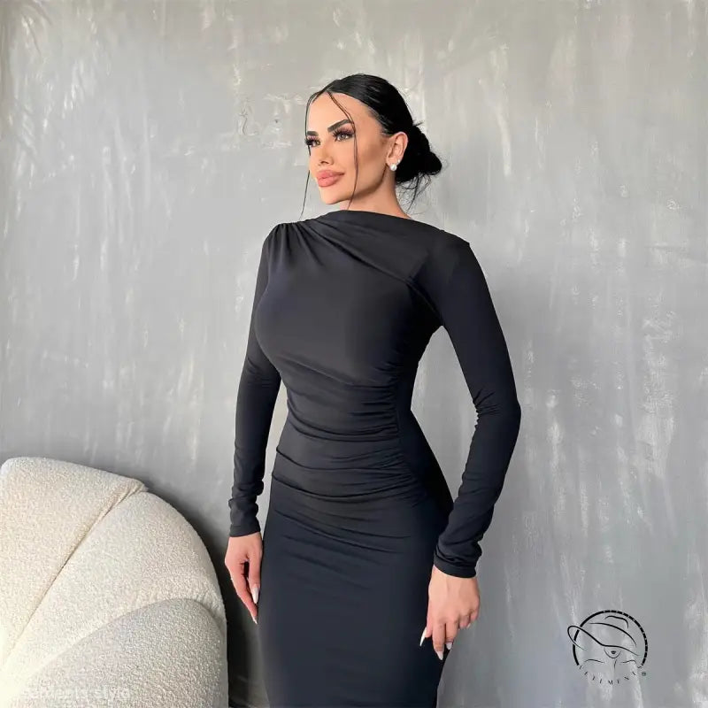 Woman in elegant bodycon dress in coral red or dark grey with bun hairstyle