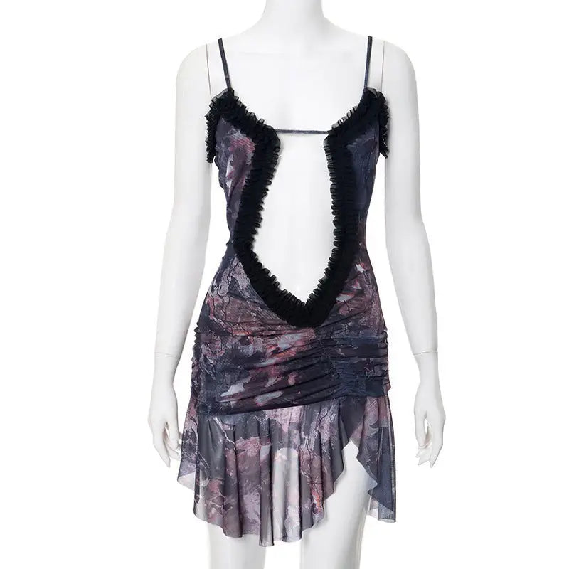 Elegant sleeveless dress with plunging neckline, ruffled trim, abstract purple and gray print