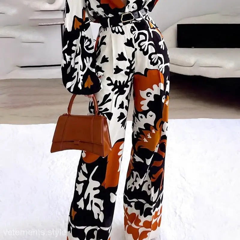 Elegant bohemian contrast casual two-piece jumpsuit with black belt and brown handbag