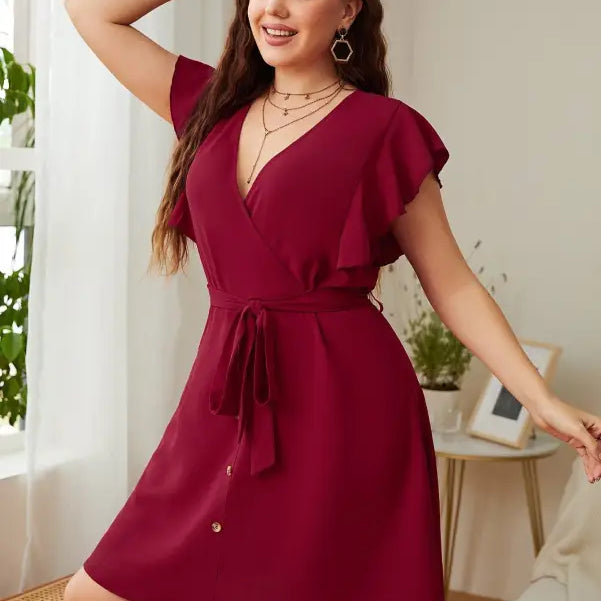 Burgundy butterfly sleeve dress featuring a loose fit and elegant ruffle details