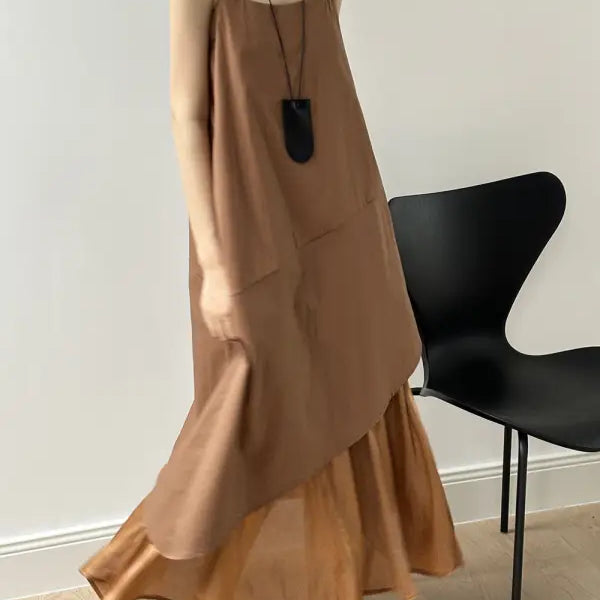 Flowy tan maxi hem stitching dress with ruffled hem, sleeveless design, pocket, and zipper