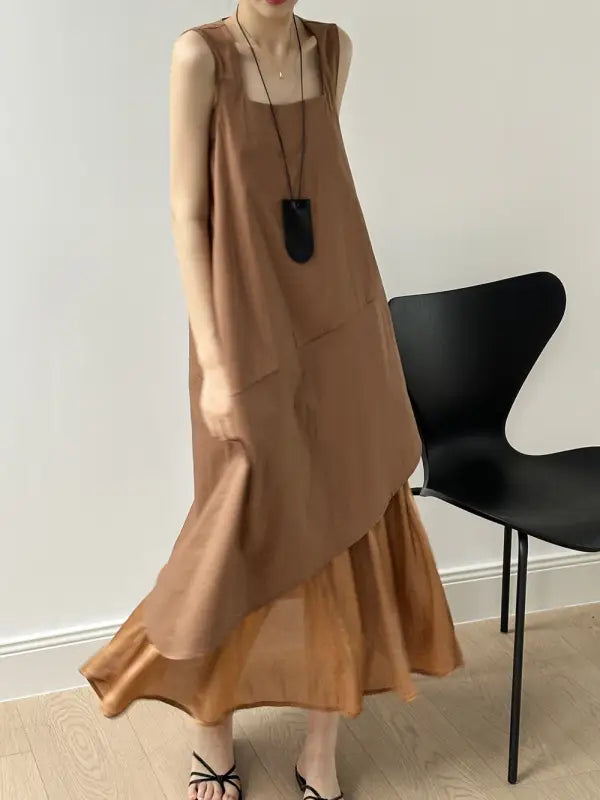 Flowy tan maxi hem stitching dress with ruffled hem, sleeveless design, pocket, and zipper