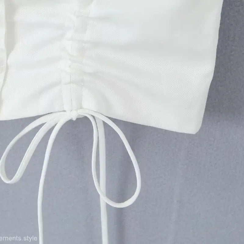 White drawstring blouse from casual skirt set ideal for summer beach outfits