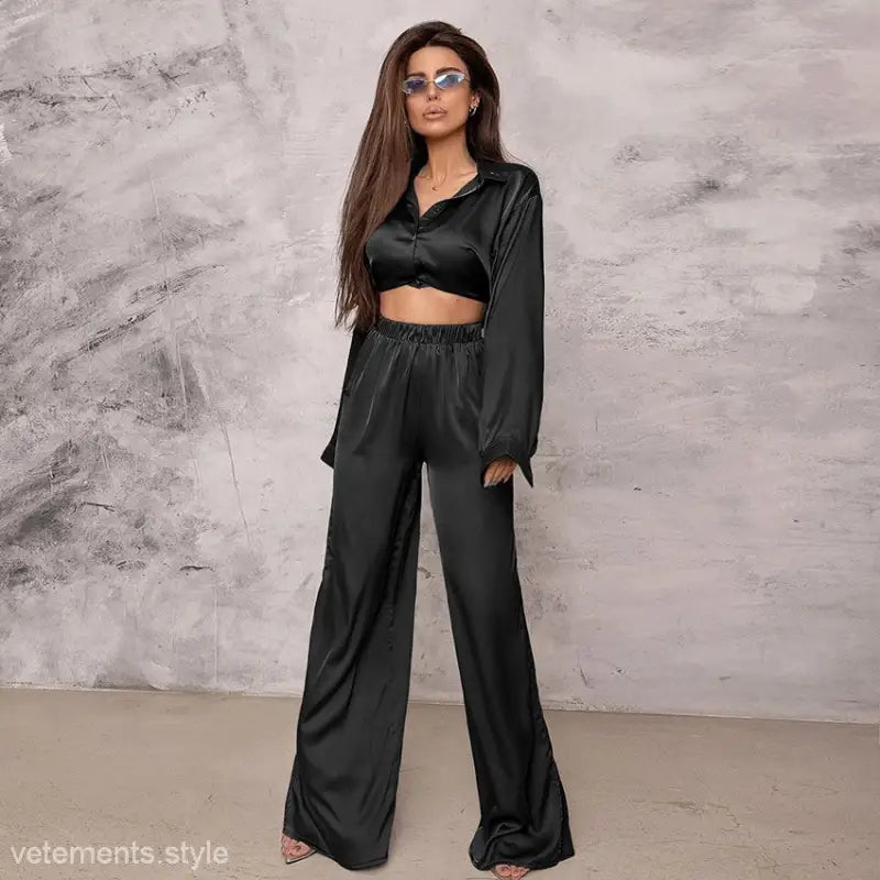 Woman wearing black crop top and wide-leg pants from Elegant Casual Spring Pajamas Set