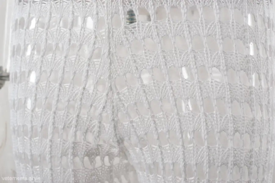 White sequined fabric detail on elegant cotton summer beach pants with lace and tulle