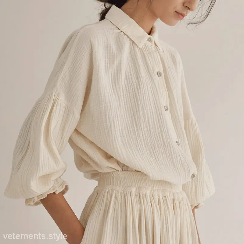Cream-colored textured blouse and skirt set showcasing lantern sleeve niche design