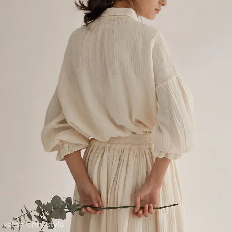 Creamy textured blouse and skirt featuring lantern sleeve niche design for seasonal style