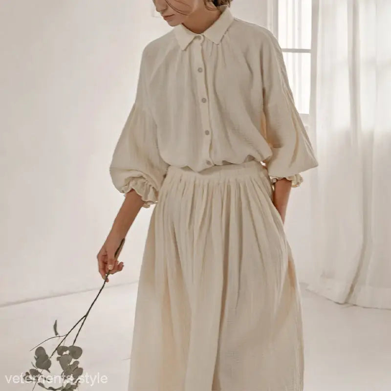 Cream-colored linen blouse and skirt set showcasing suit lantern sleeve and sleeve niche design