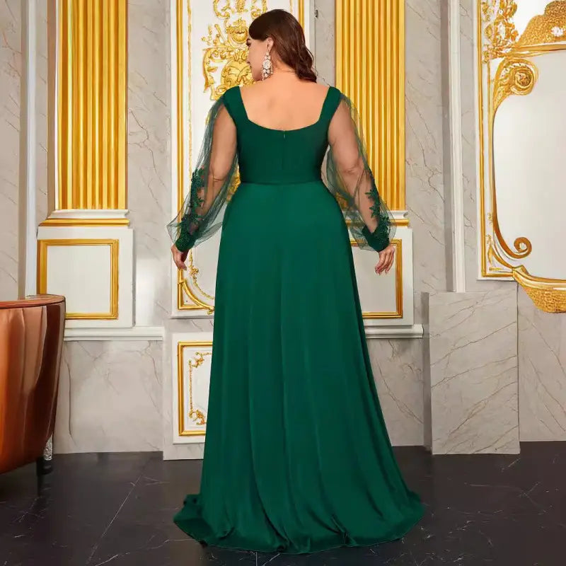 Emerald green long-sleeved elegant evening dress with sheer embroidered sleeves for formal events