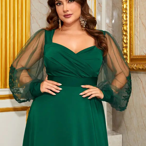 Plus-size emerald green elegant evening dress with sheer puff sleeves and lace detailing
