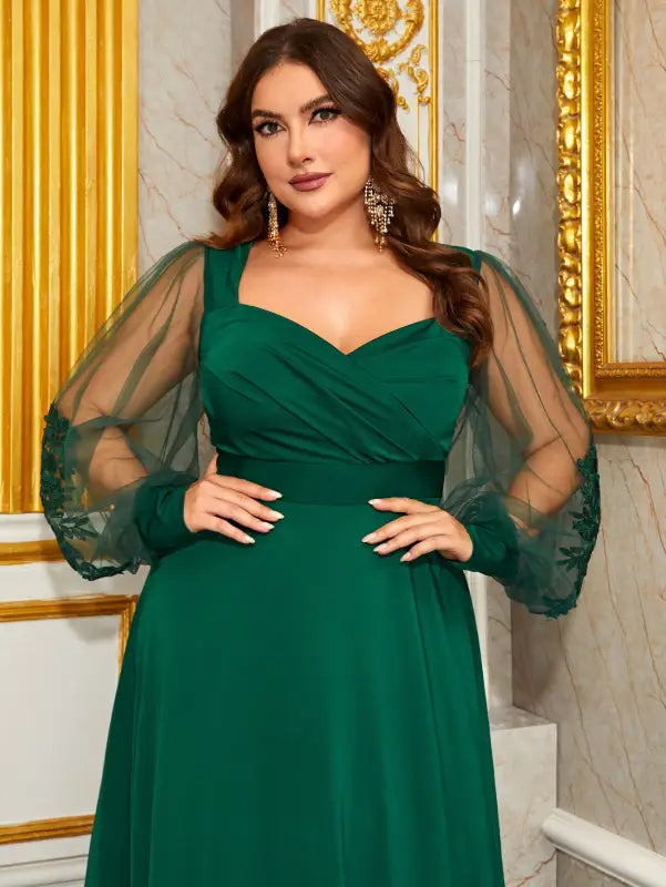 Plus-size emerald green elegant evening dress with sheer puff sleeves and lace detailing