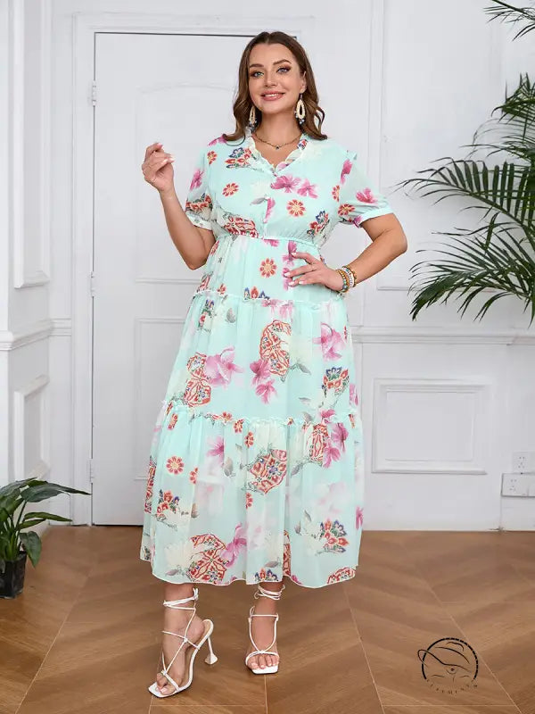 Elegant evening maxi dress in light green floral print with ruffles