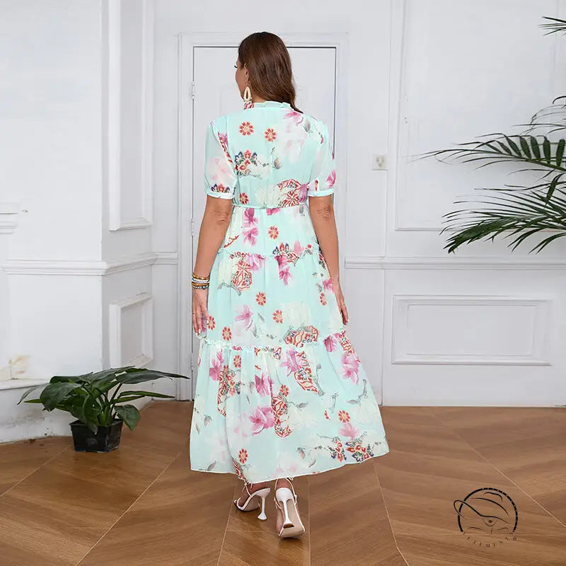 Elegant evening maxi dress in light green floral print with ruffles