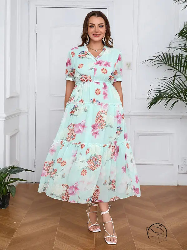 Elegant evening maxi dress in light blue floral with ruffles and tiers