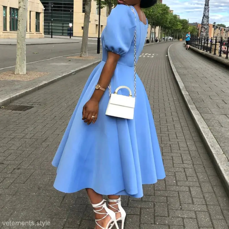 Light blue elegant evening puff sleeve dress with a full A-line midi skirt