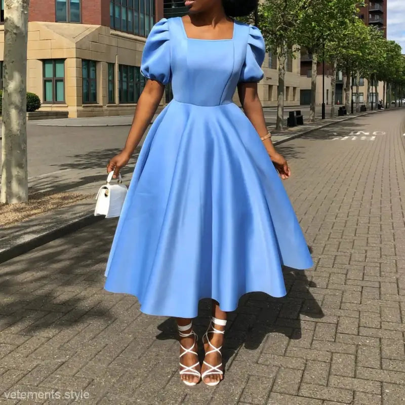 Elegant evening puff sleeve dress featuring a light blue midi length with full skirt