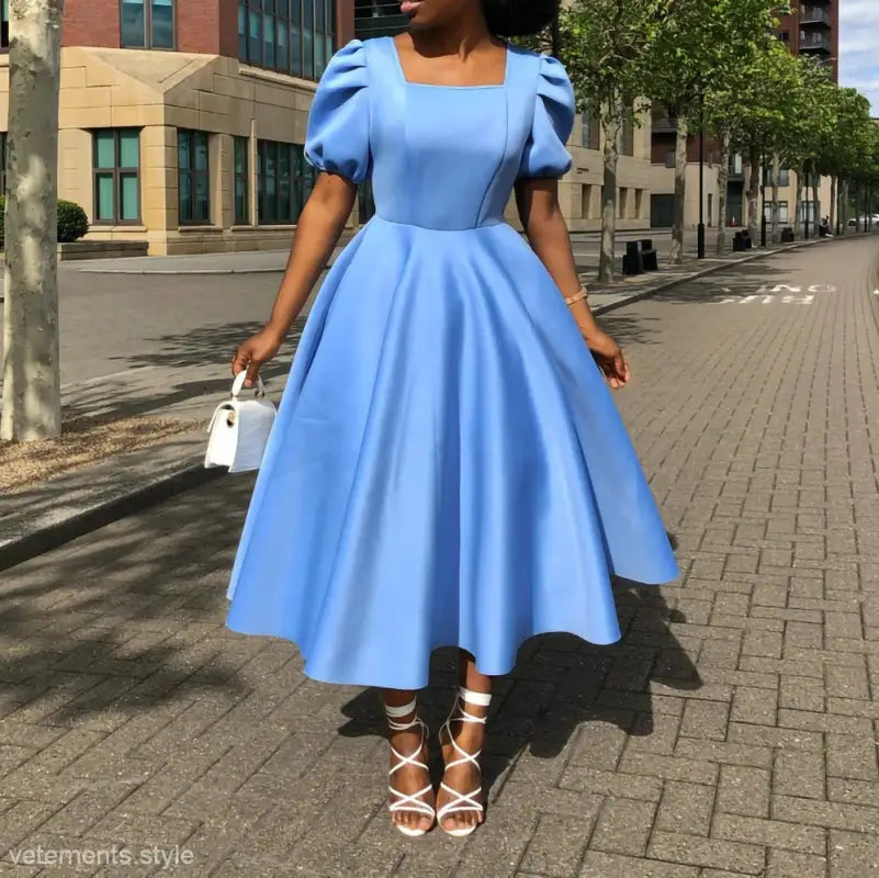 Elegant evening puff sleeve dress featuring a light blue midi length with full skirt