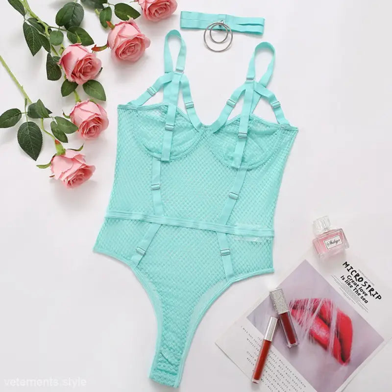 Mint green lace bodysuit with adjustable straps in an Elegant Fishnet Teddy body shaping jumpsuit
