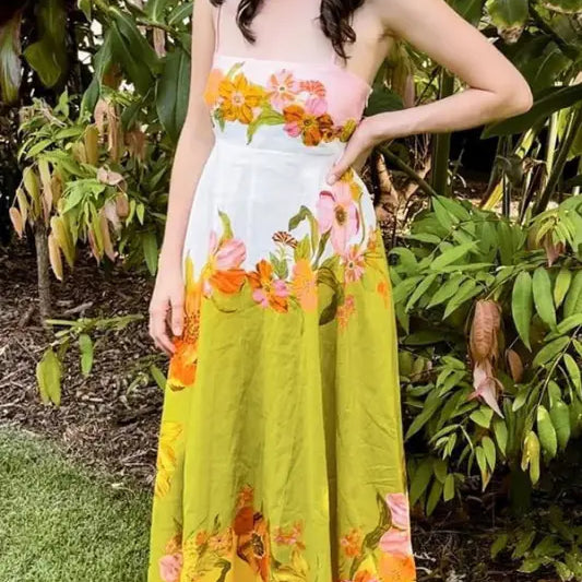 Colorful floral maxi dress with a gradient from pink to white to yellow.