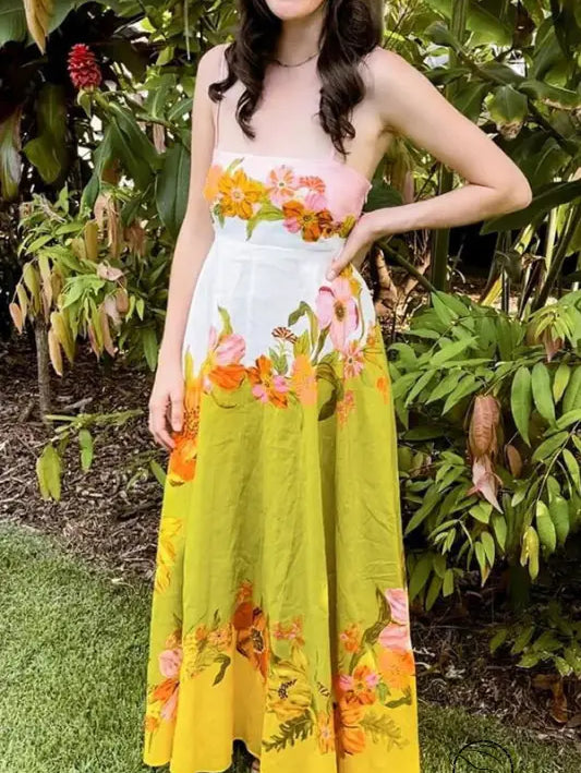 Colorful floral maxi dress with a gradient from pink to white to yellow.