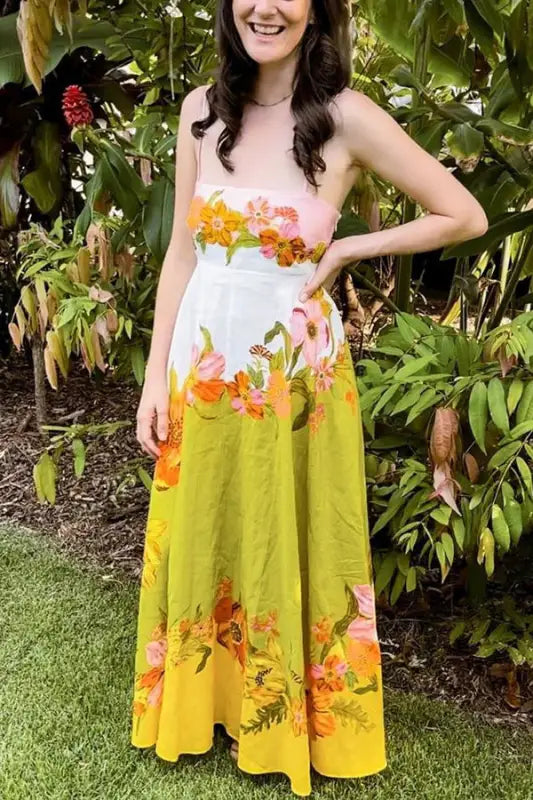 Colorful floral maxi dress with a gradient from pink to white to yellow.