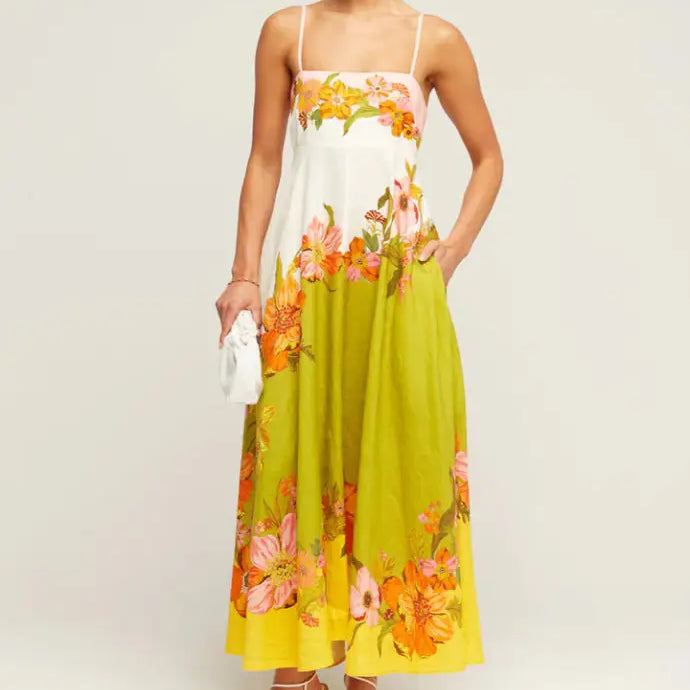 Floral maxi dress with spaghetti straps in white, lime green, and orange tones.