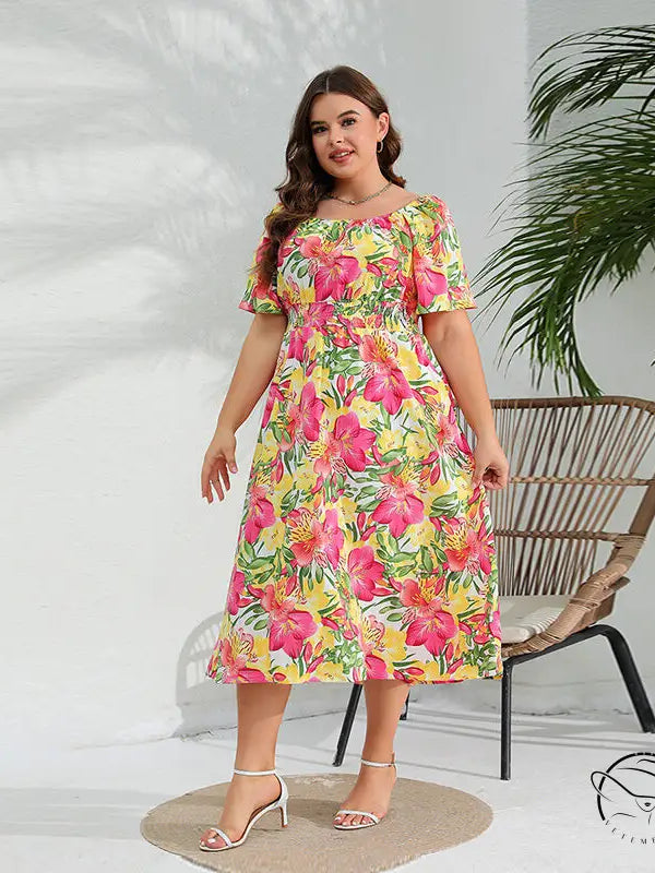 Elegant floral midi dress with short sleeves and shirred waist