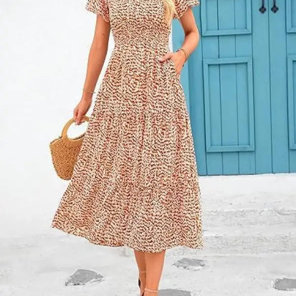 Floral print midi dress with short sleeves and tiered skirt, a stylish bubble pleated dress