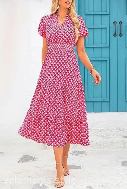 Pink and white floral midi dress features short sleeves and a v-neckline, perfect bubble pleated dress