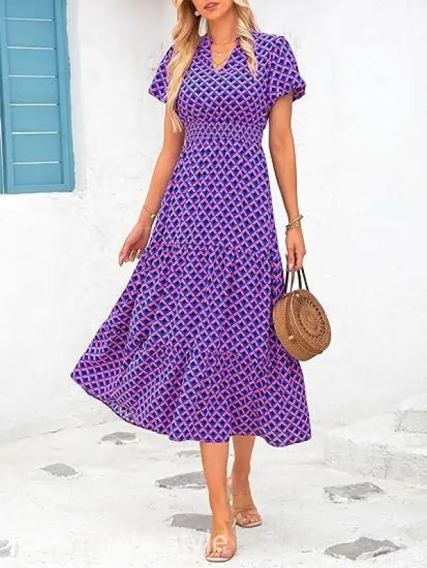 Purple and blue patterned bubble pleated dress with short sleeves and v-neck design