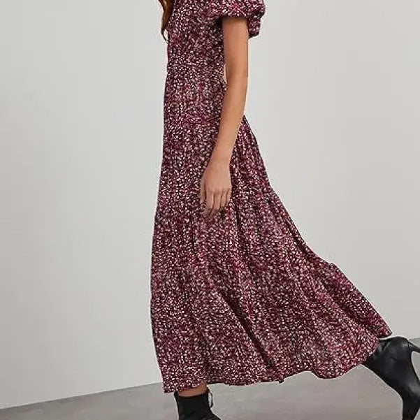 Floral bubble pleated dress with puff sleeves and tiered skirt, styled with ankle boots