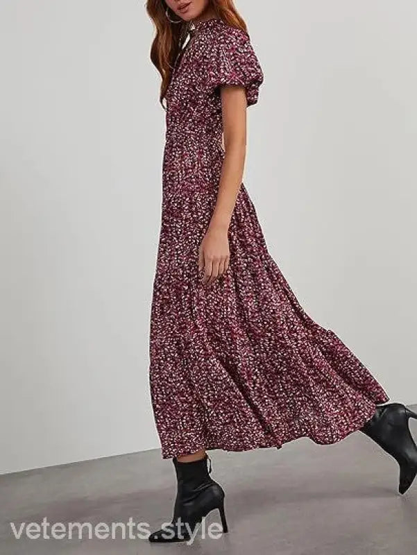 Floral bubble pleated dress with puff sleeves and tiered skirt, styled with ankle boots