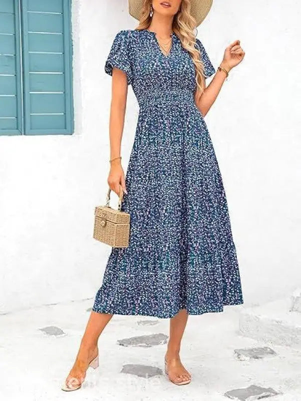 Blue floral print bubble pleated dress with short sleeves and a v-neckline