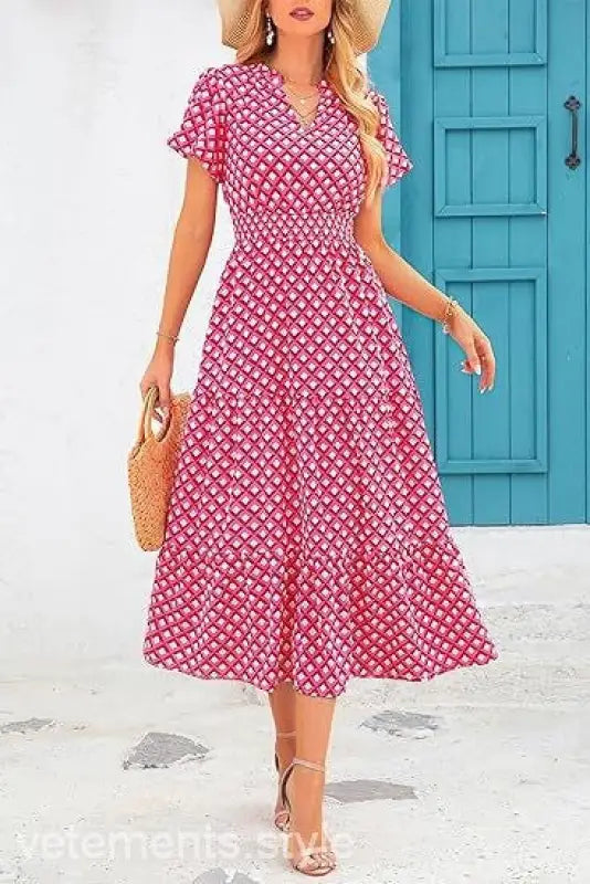 Pink and white floral bubble pleated dress with short sleeves and v-neckline