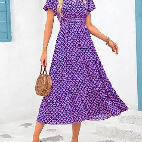 Purple and pink patterned bubble pleated dress with short sleeves and V-neck design