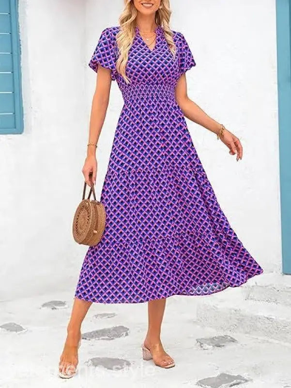 Purple and pink patterned bubble pleated dress with short sleeves and V-neck design