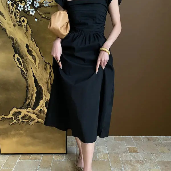 Elegant Flying Dress in black with ruffled cotton and butterfly sleeves, sold online