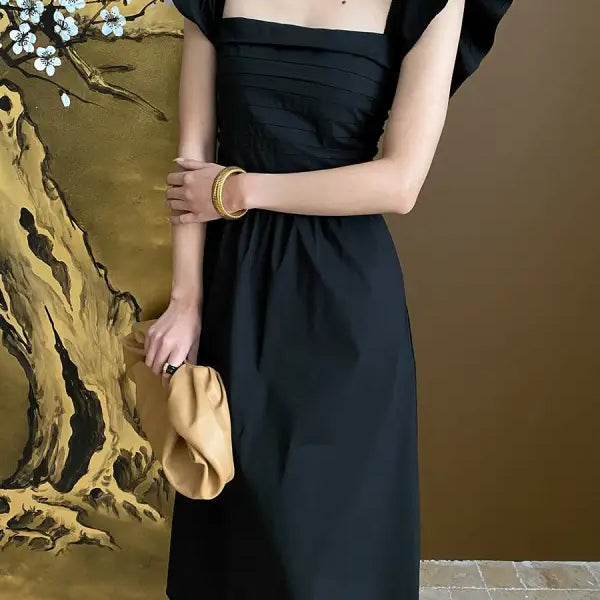 Elegant Flying Dress: Black Ruffled Cotton Midi with Butterfly Sleeves - sold