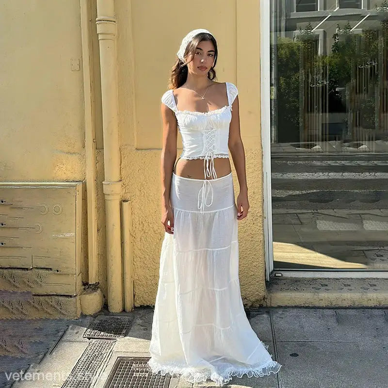 Woman in white peasant-style outfit featuring Elegant French Collar and Lace Stitching Skirt
