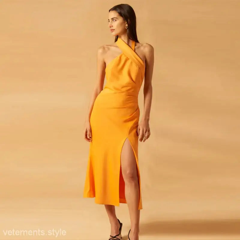 Orange halter midi dress in elegant french fishtail dress style for boho summer vacations