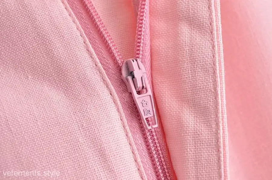 Elegant French style sleeveless dress featuring a pink zipper on polyester fabric