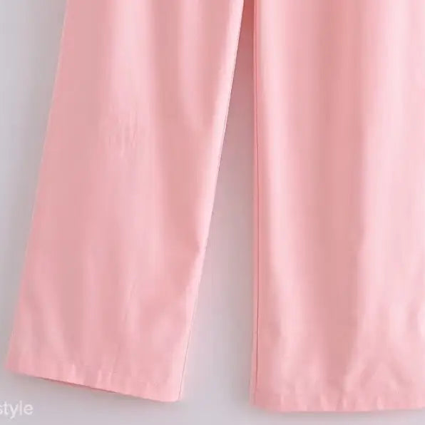 Elegant French style pink wide-leg pants displayed with a sleeveless V-neck polyester outfit