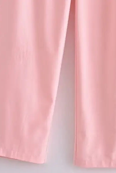 Elegant French style pink wide-leg pants displayed with a sleeveless V-neck polyester outfit