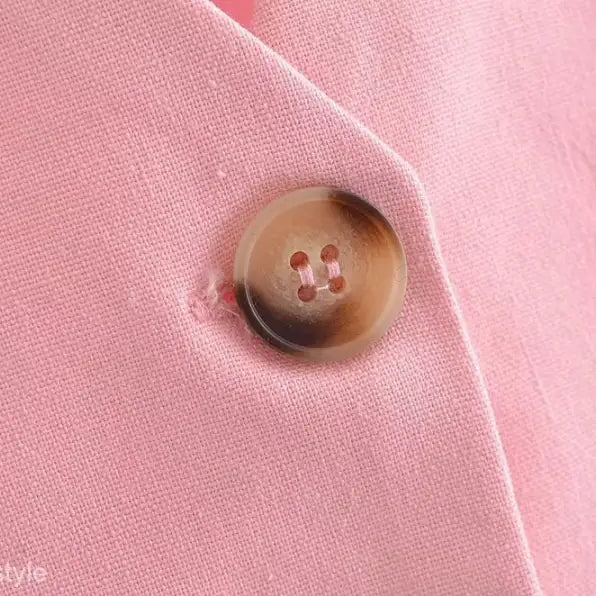 Elegant French style pink fabric with a brown button for sleeveless V-Neck polyester top